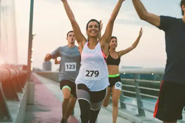 woman running happy arms up with no concern of stress incontinence Bath